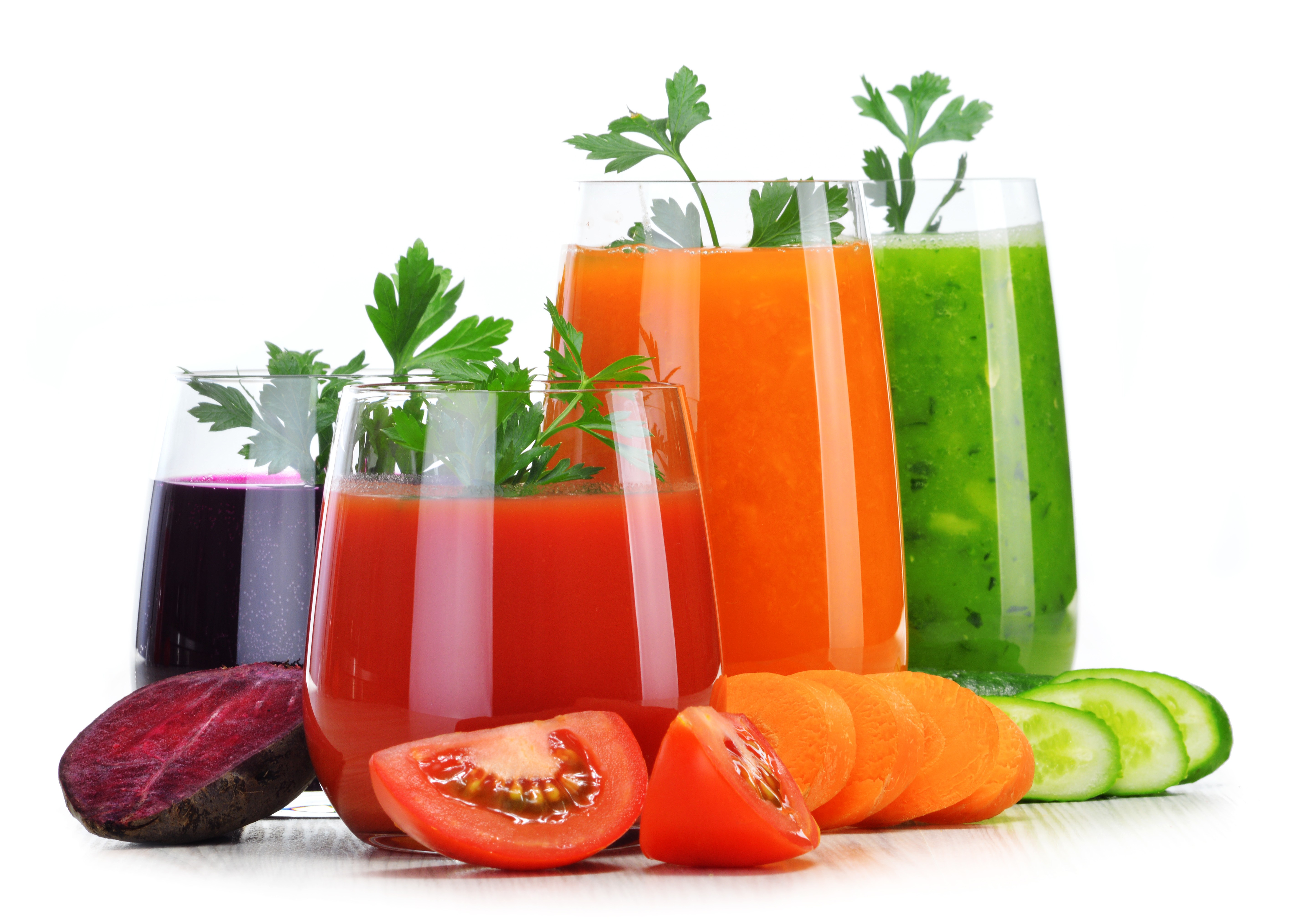 Glasses with fresh vegetable juices isolated on white. Detox diet.